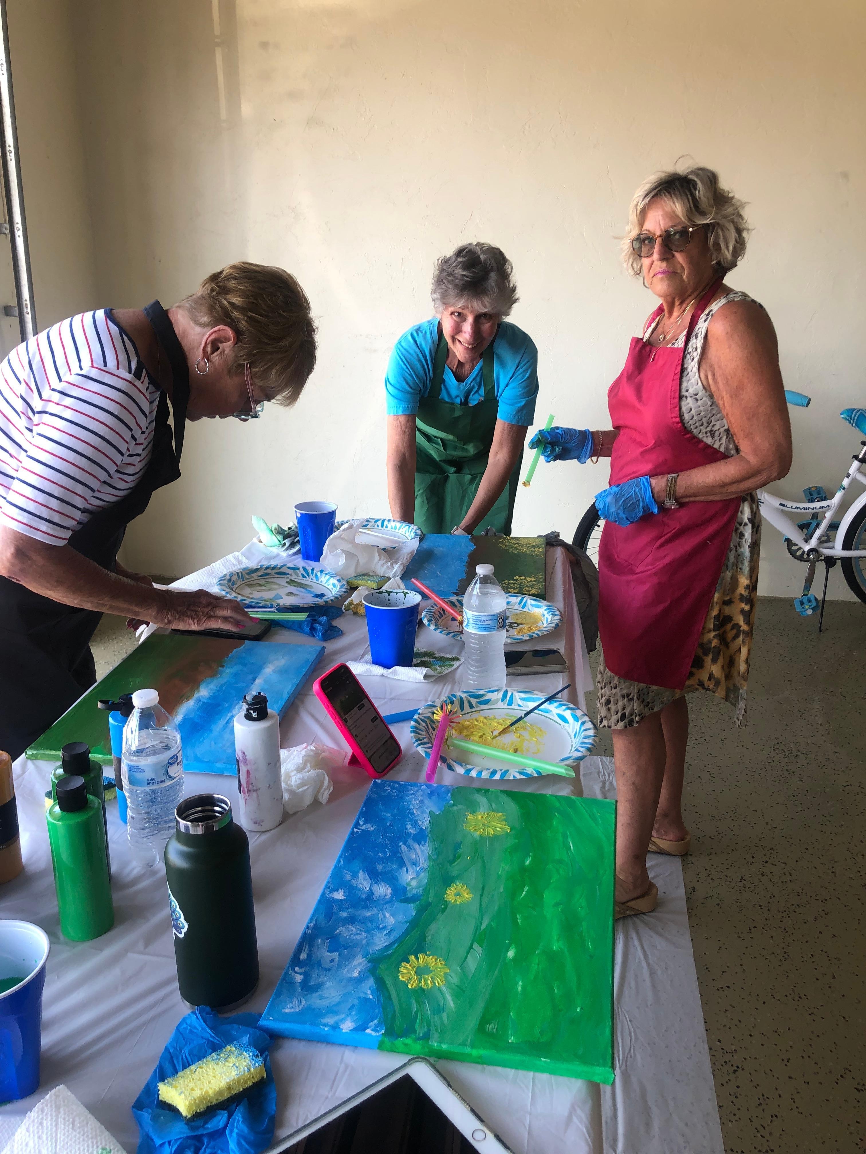 A few friends doing crafts in the garage.