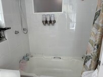 Shower over narrow and in parts mouldy bath. Nothing to hold onto. Toiletries unlabelled so donât know which is which.