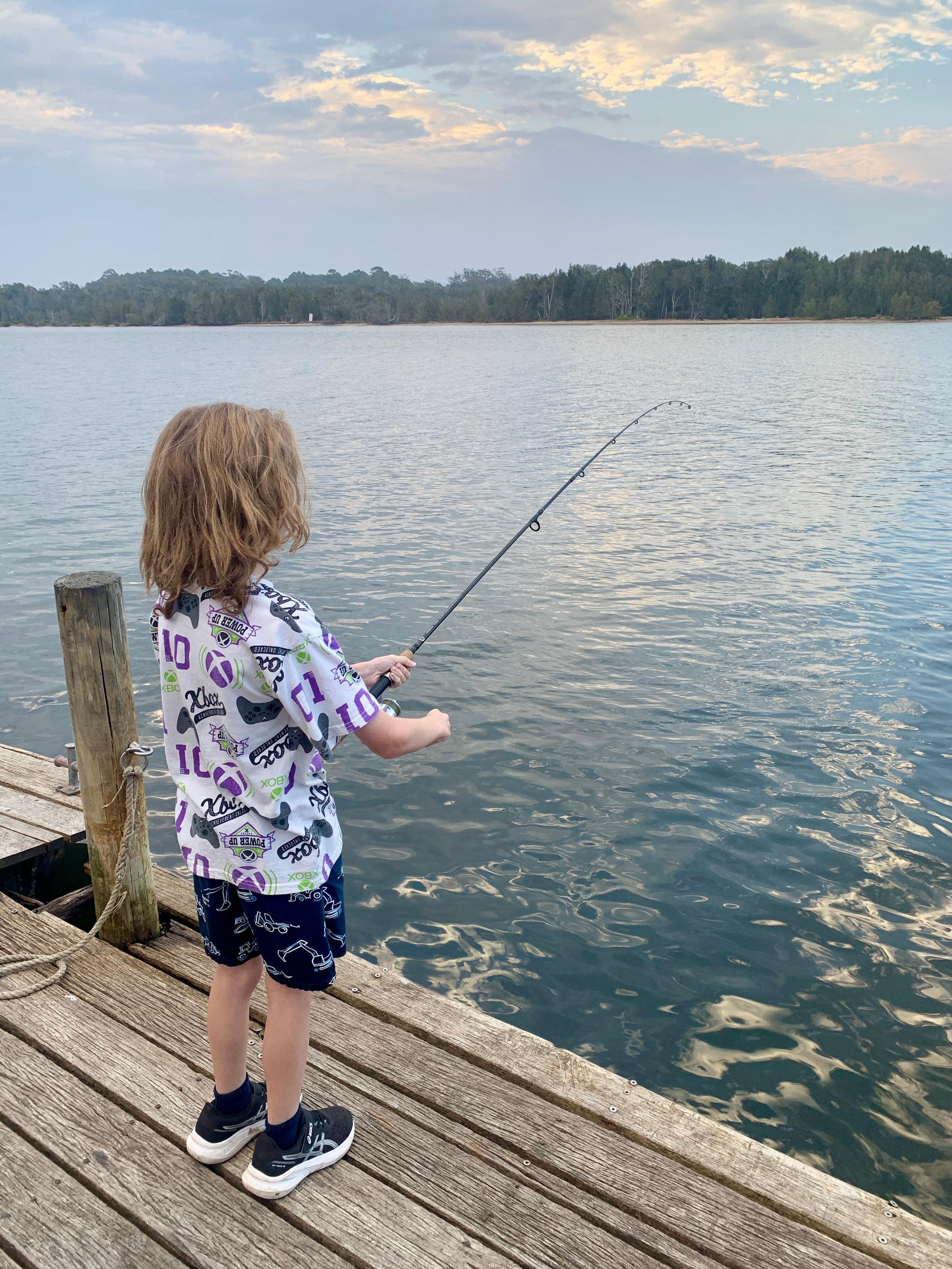Fishing at the boat shed.