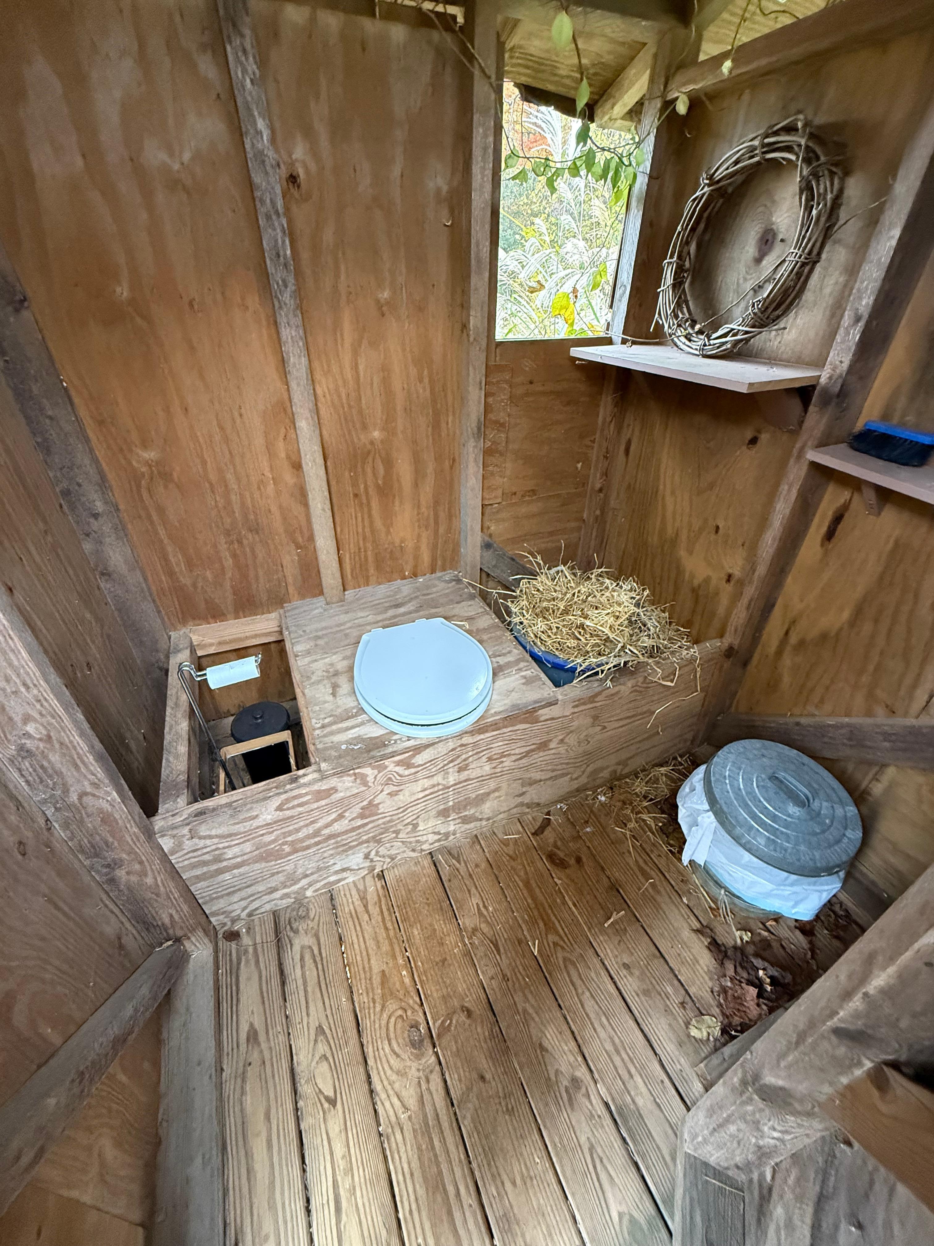 Inside the outhouse.