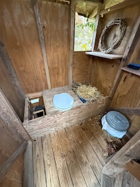 Inside the outhouse.