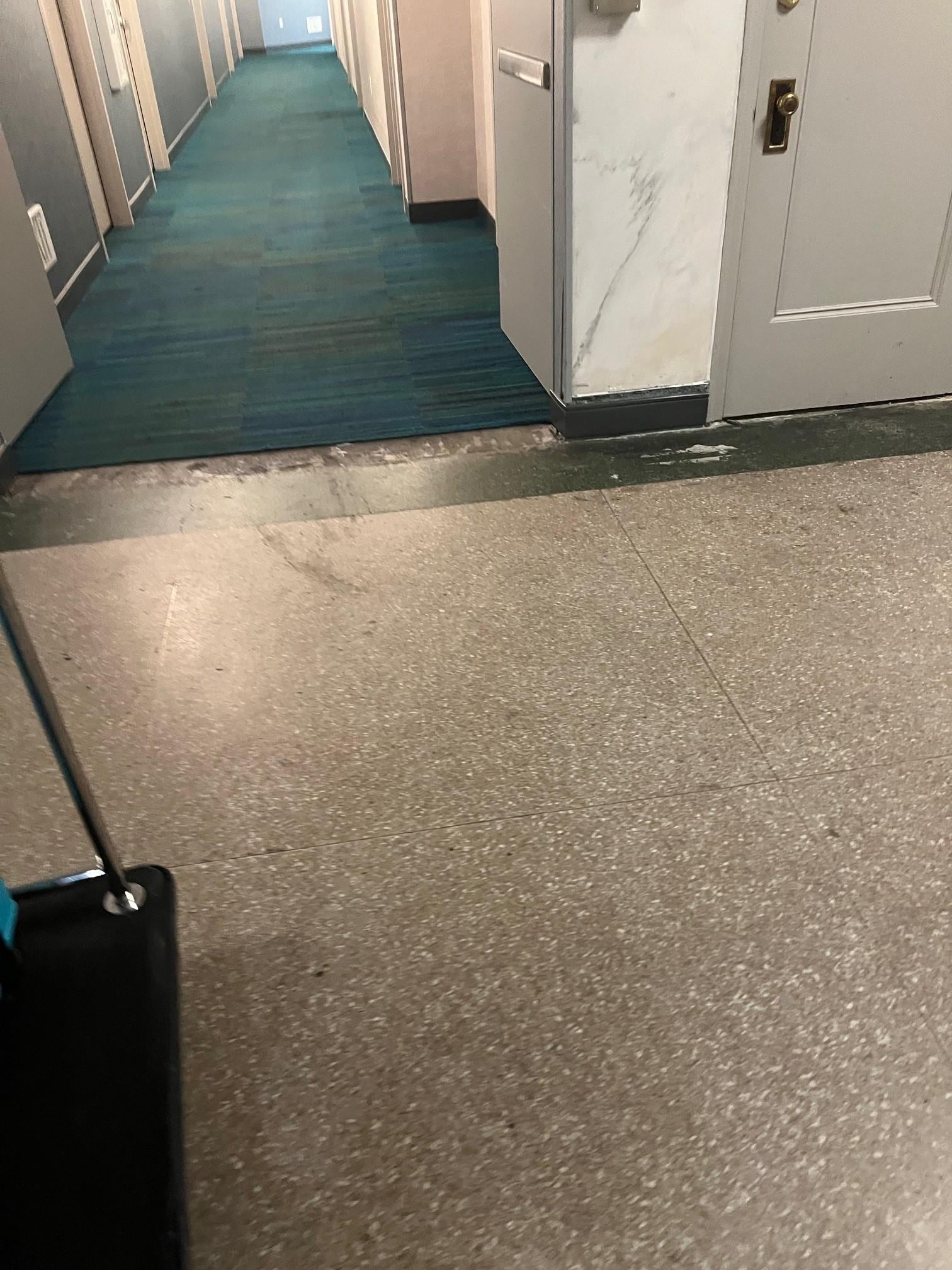 Area outside of elevator on floor with rooms