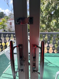 The gap in the sliding glass doors. This is how it locked.