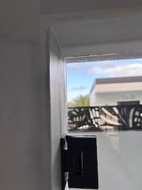 No one actually needs an outdoor shower--but you do need doors to the outside that seal so that bugs don't get in.