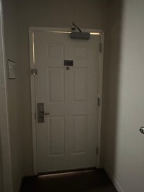 Door with damaged frame and entry