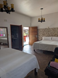 Room 10 on the ground level with two king beds looking into courtyard