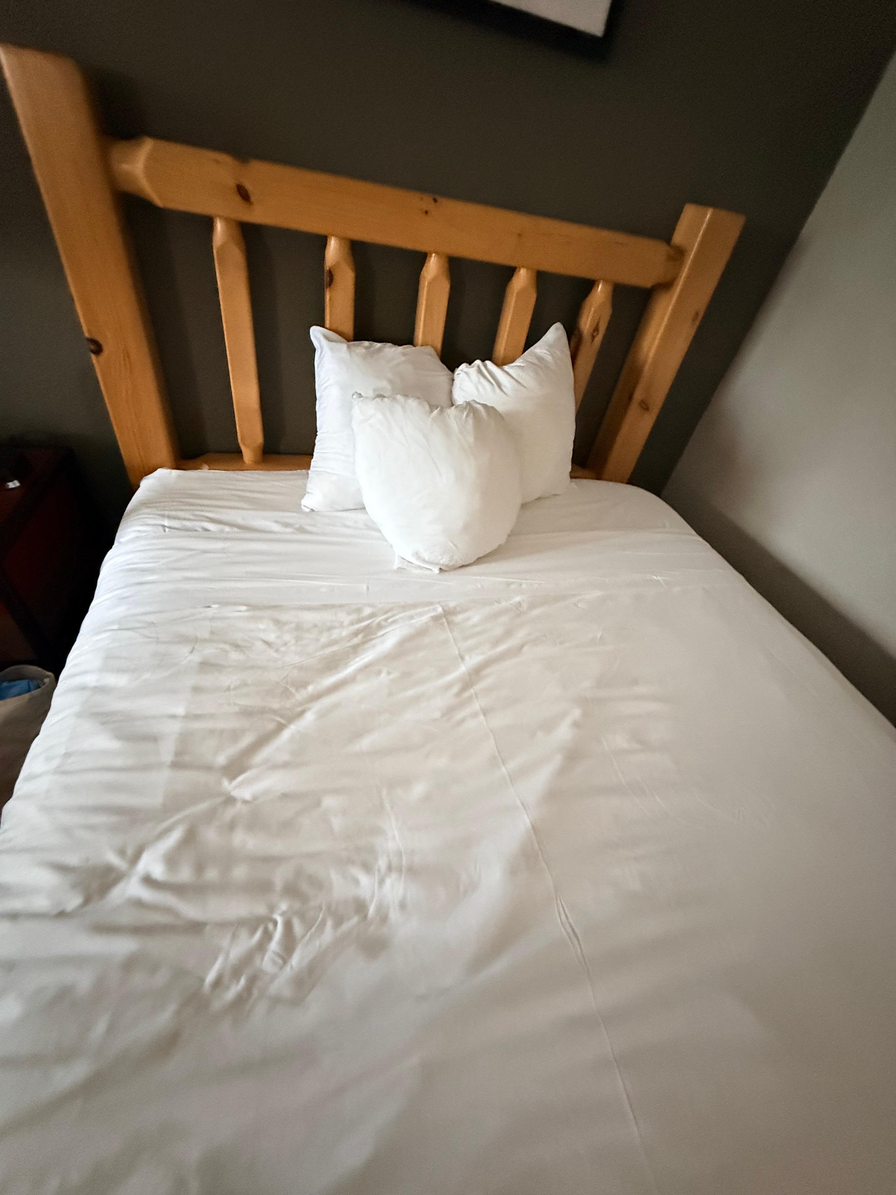 Small pillows in standard pillow cases rolled up.  This is what we walked into.  Hairs all over sheets and visible drool stained pillowcases.