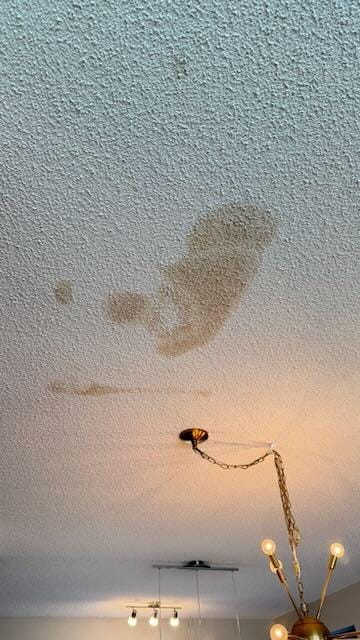 Huge brown stain on the ceiling.  Toilet leak?