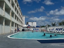 Our room was the first on the left. Barely a walkway to get around the pool. And the hotel double locks the gates from evening until mid morning so that you cannot leave the patio to get to the restaurant or the beach. You must go through your room