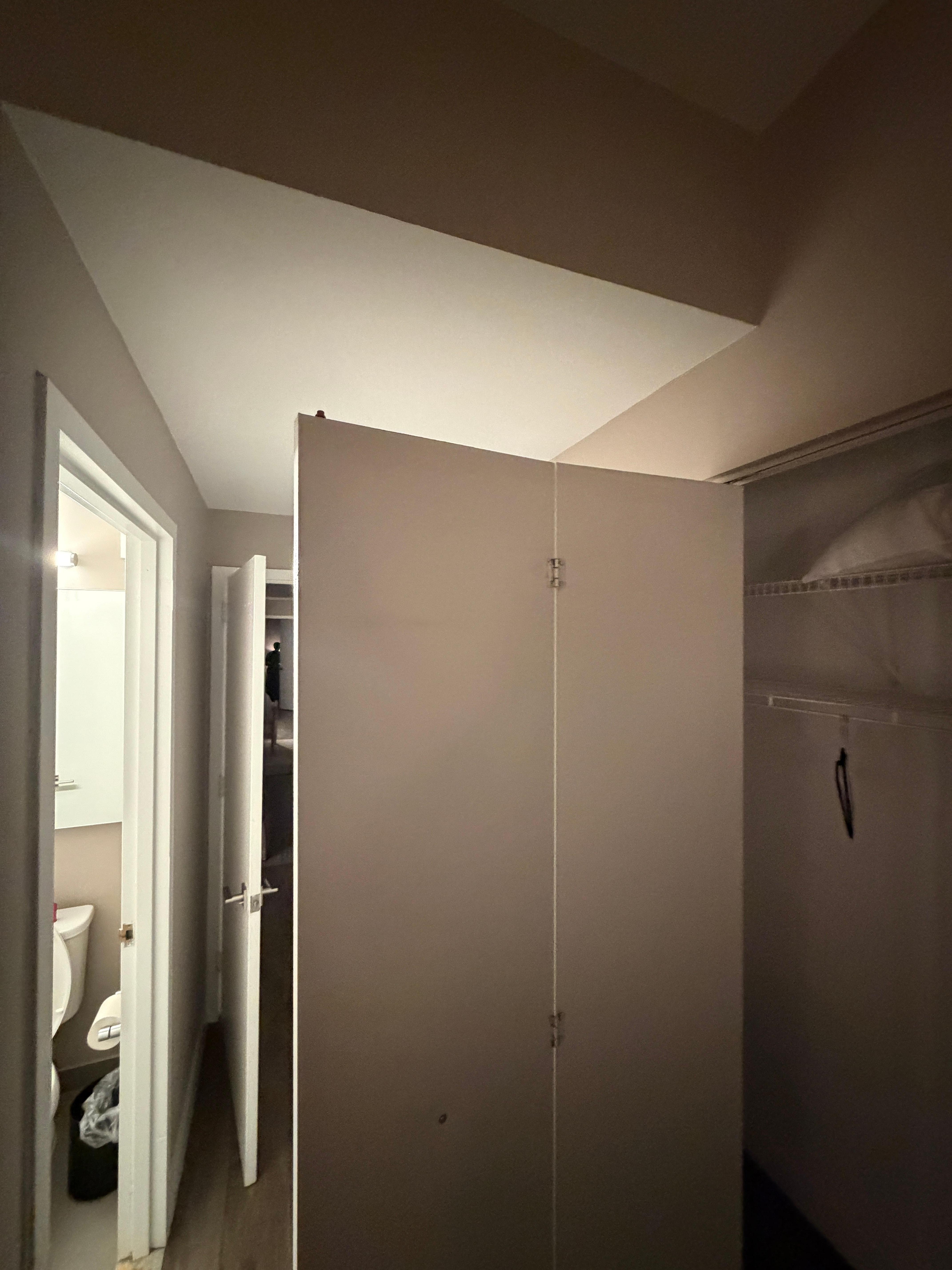 Every closet door was like this.  The hinge was broken so they swung open like this.  