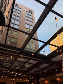 Patio area located off the bar. Very nice and clean. Glass ceiling is really cool at night. Especially when it snowed.