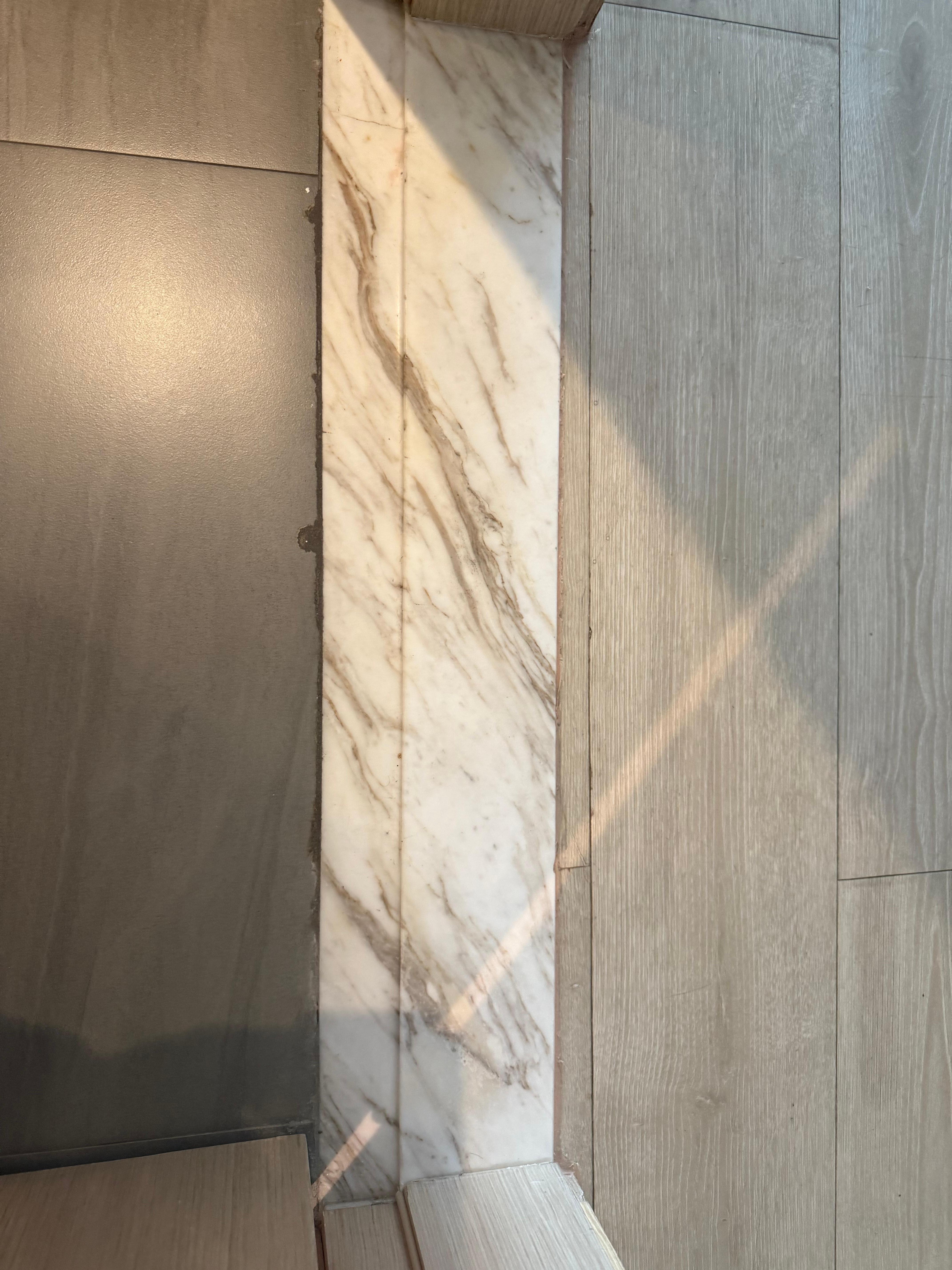 Cracked floor tile bathroom threshold 