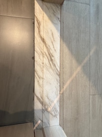 Cracked floor tile bathroom threshold