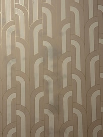 Weird stains or mold coming through wallpaper.