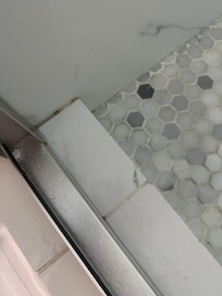 Mildewed shower AFTER second cleaning from management.