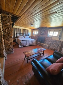 Step down to the bed and couch area