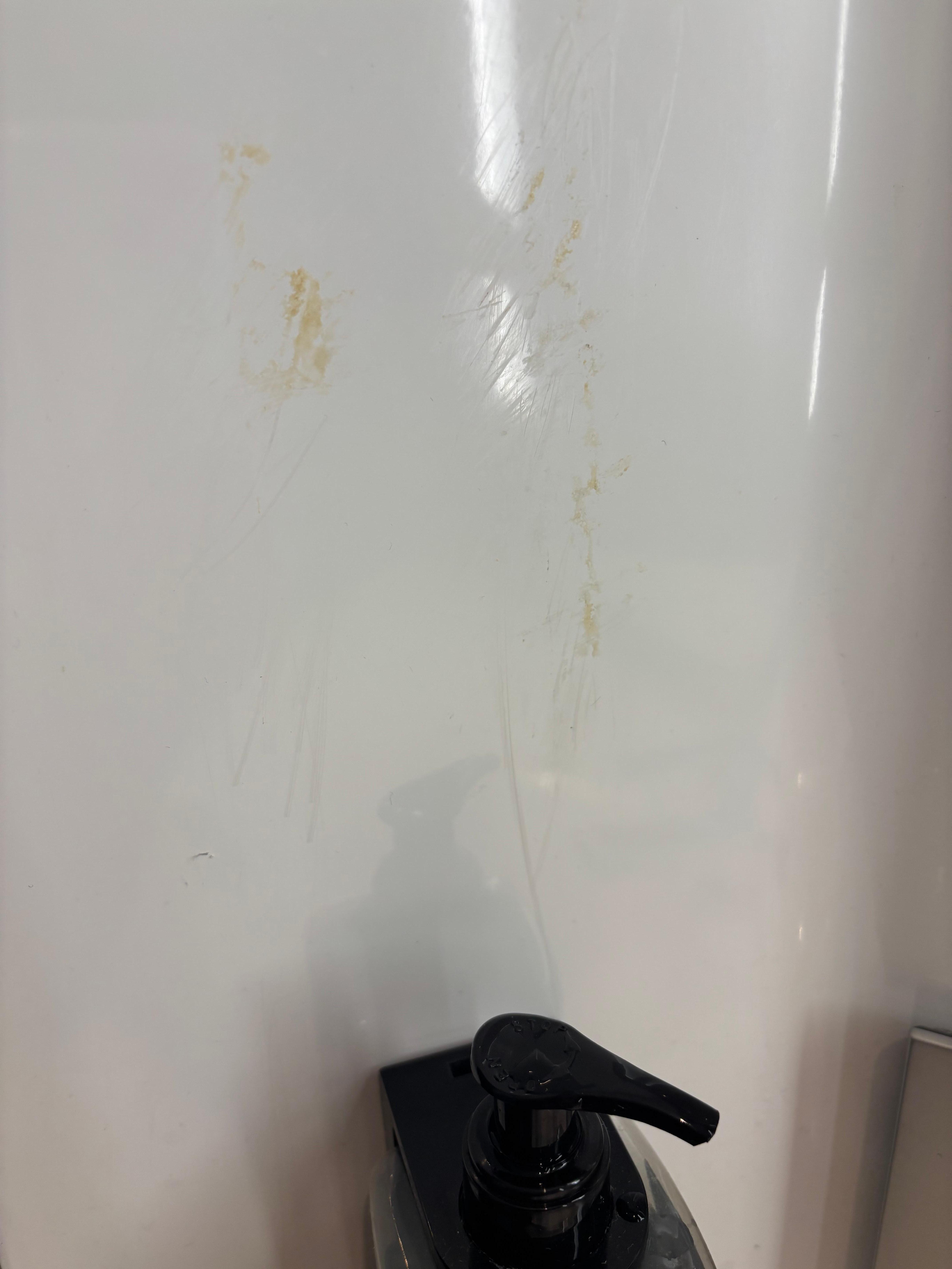 Dirt on the bathroom wall