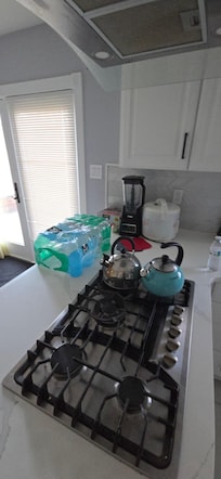 Random stuff left on counter and stove top