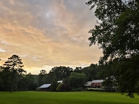 View of the rear of the hotel from the back of the field.
