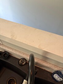 Dirty footprint marks on the counter in the kitchen