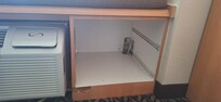 No door or drawers are present, also exposing wire in the back