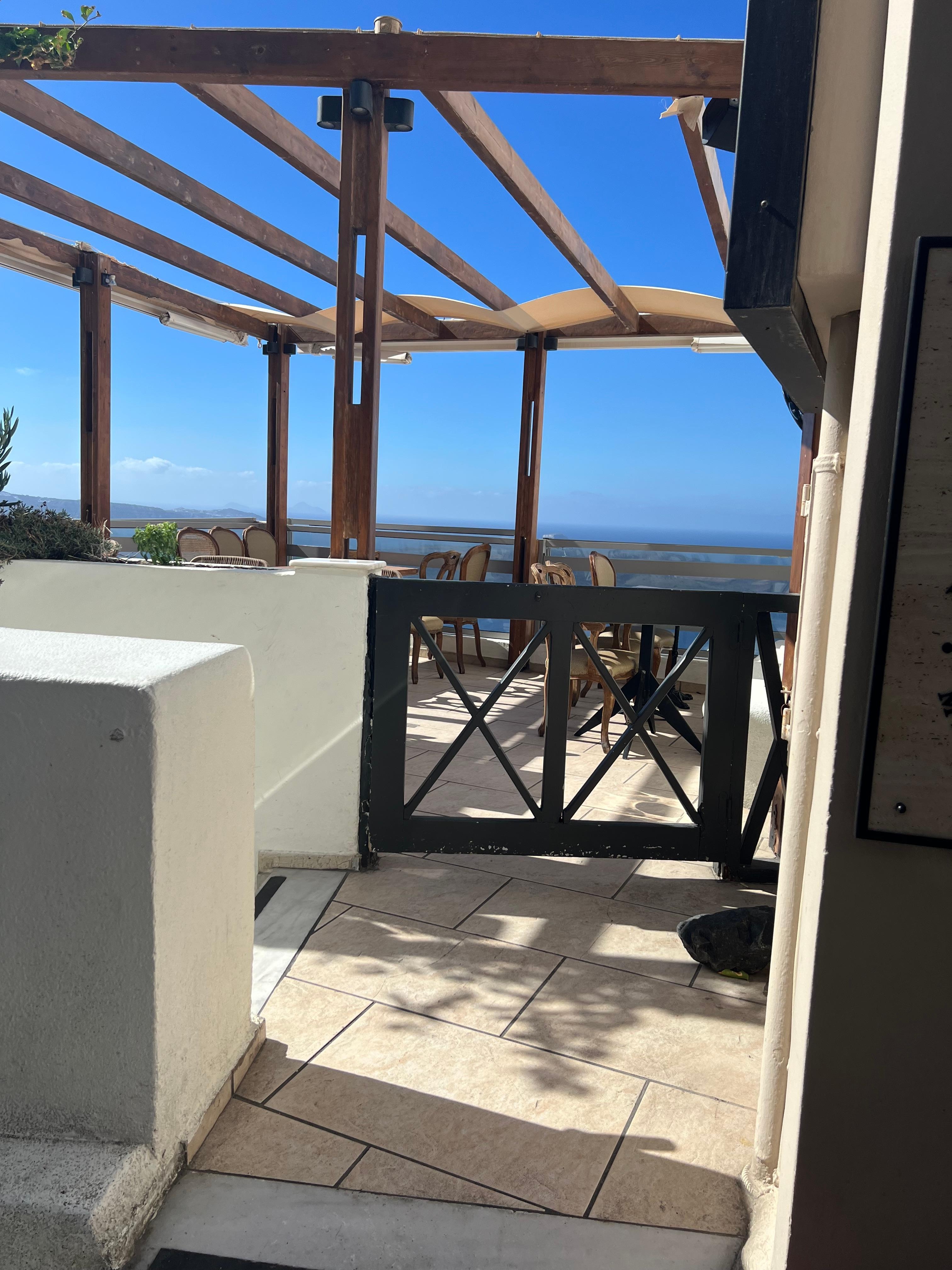 Go down the steps right by this gate 