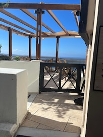 Go down the steps right by this gate