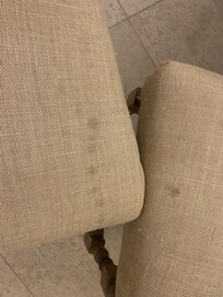 2 of 6 stained dining
table chairs. Not an
appetizing look when
eating.