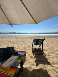 On the beach out front… lots of chairs and umbrellas!!!