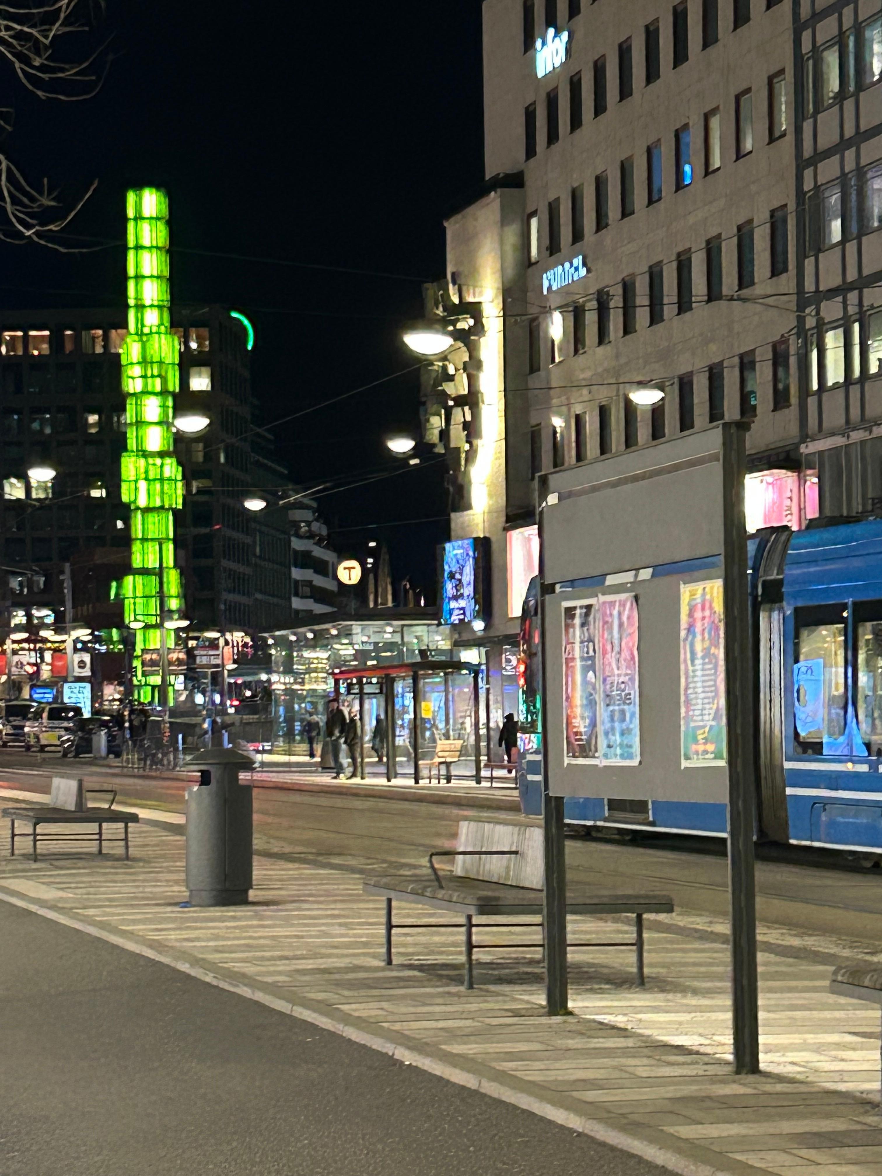 Sergels Torg with the Glass Tower in green lights. 
