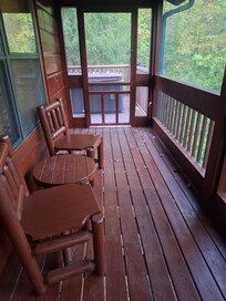 Screened in Back porch leading out to hot tub outside