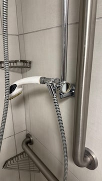 Broken shower height adjuster button.