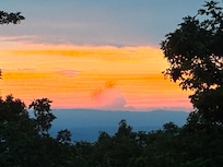 Sunset from balcony at property.