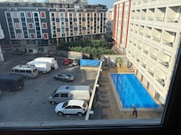 Well there is a view of the pool, but not quite what was advertised! More car park view.