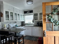 The door that leads you into the kitchen is beautiful. No blinds or shades though. We brought a light weight blanket to put on top of it before closing it at night. Another review mentioned this. Very helpful.
