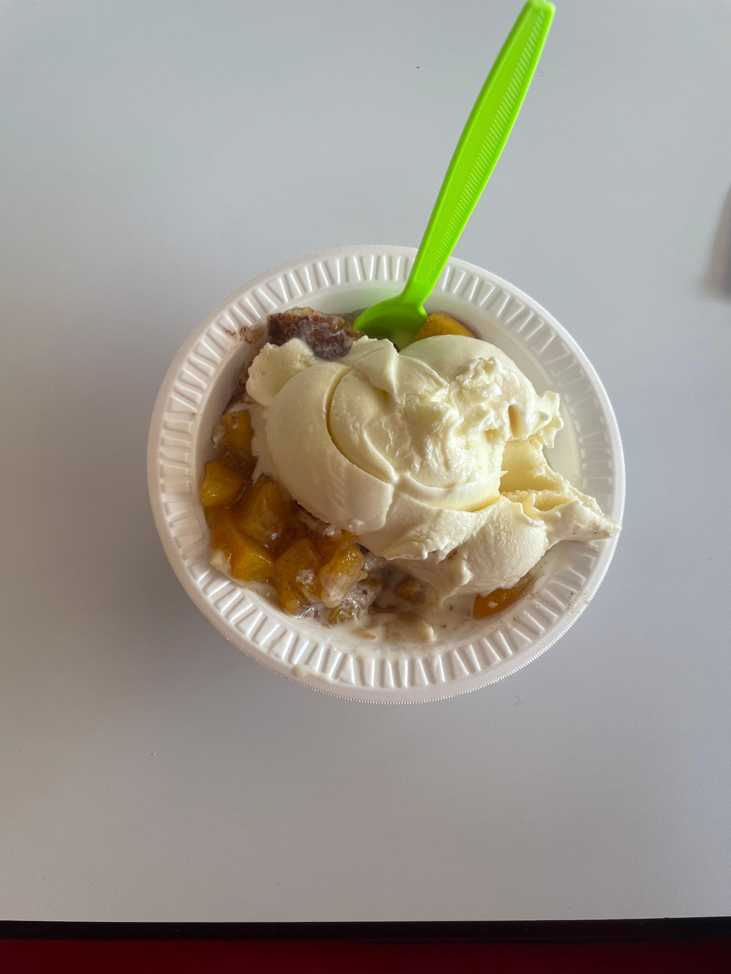 Homemade ice cream with peach cobbler