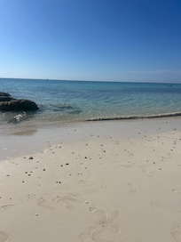 Beach directly in front of condo at low tide.