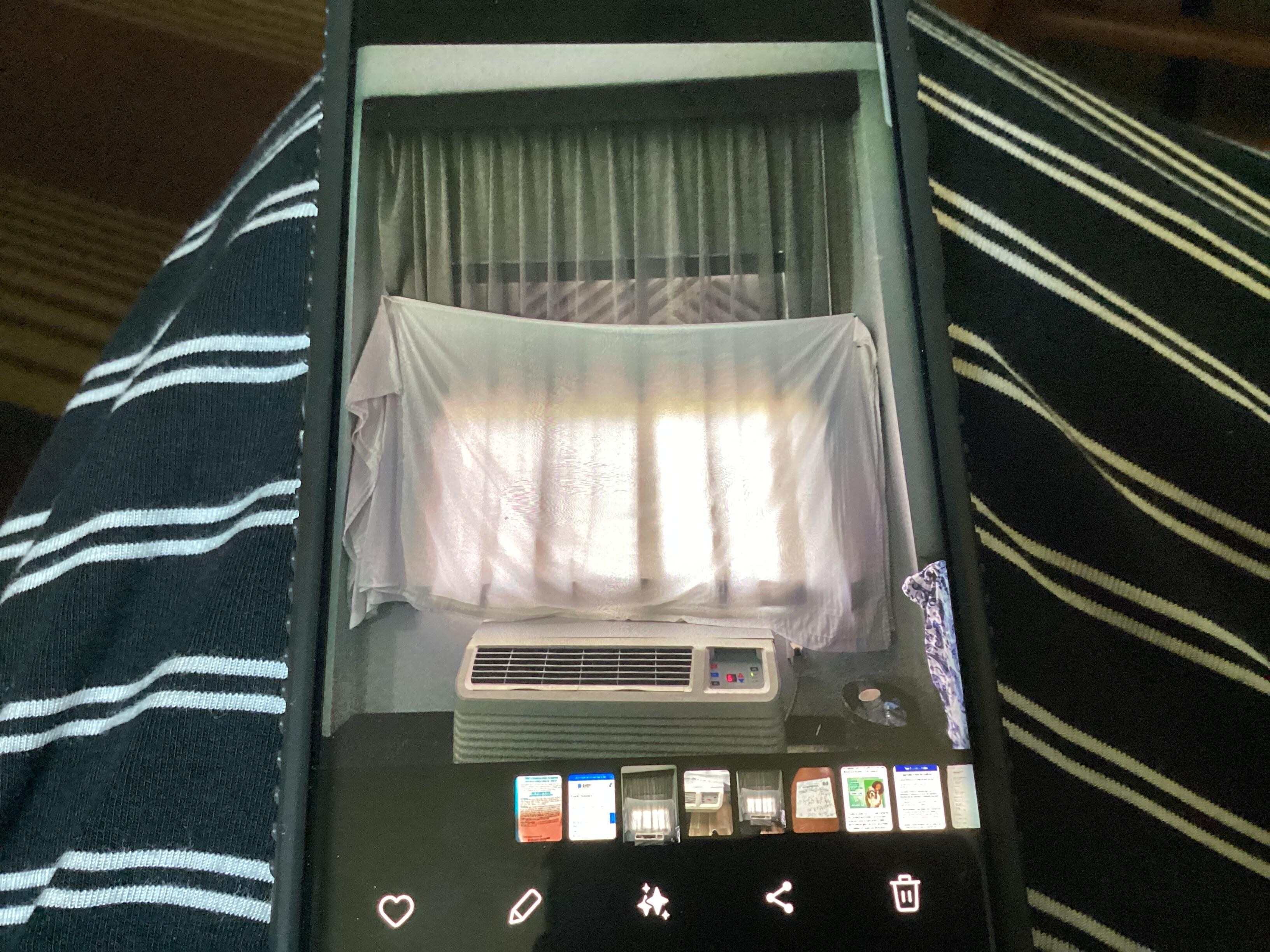 Blind would not come down. Sheet placed over window with thumbtack.