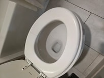 Toilet seat cracked and moved. Needed replaced.