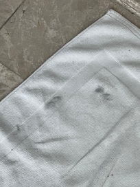 Dirty bath mats/run down bathroom