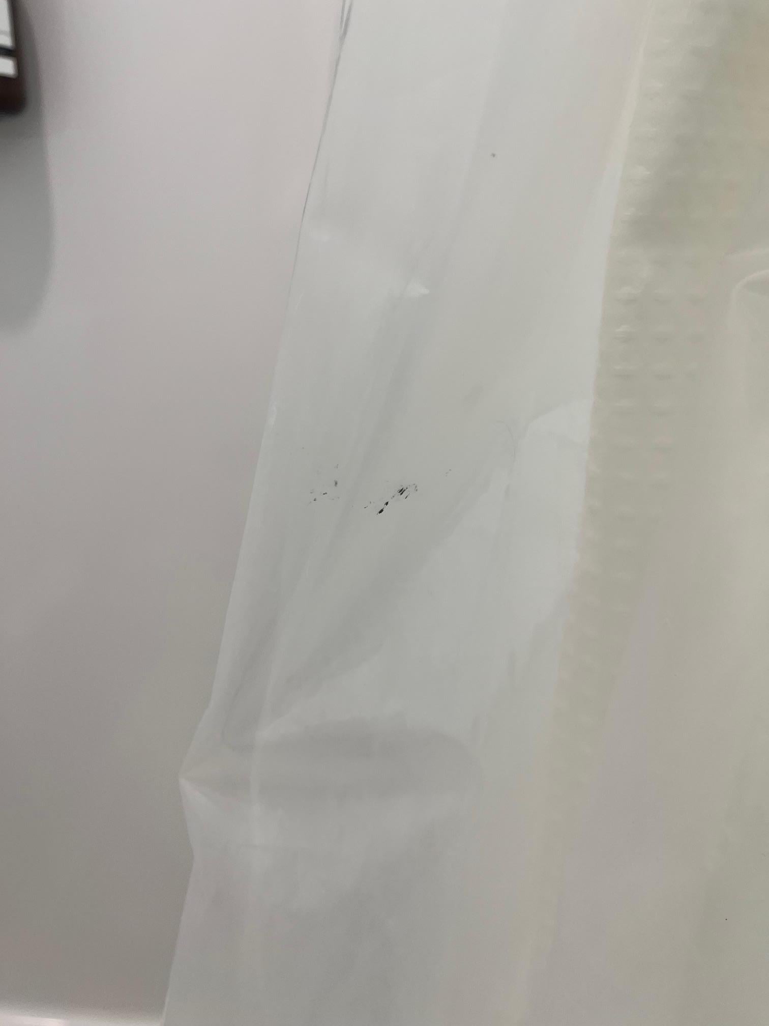 stained shower curtain with brown stains