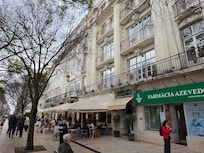 Hotel entrance - steps and lift up to 1st floor reception and lounge / dining area (above the shops and restuarants).