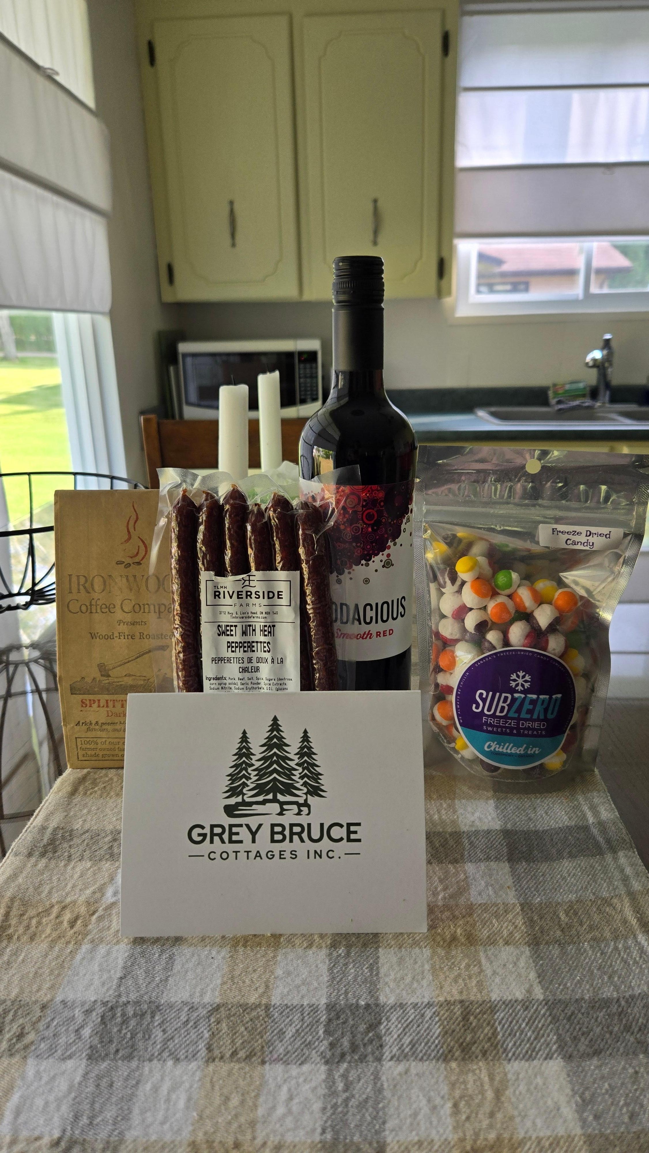 a gift of coffee, pepperettes, red wine, and some candy