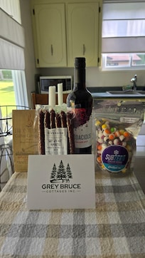 a gift of coffee, pepperettes, red wine, and some candy
