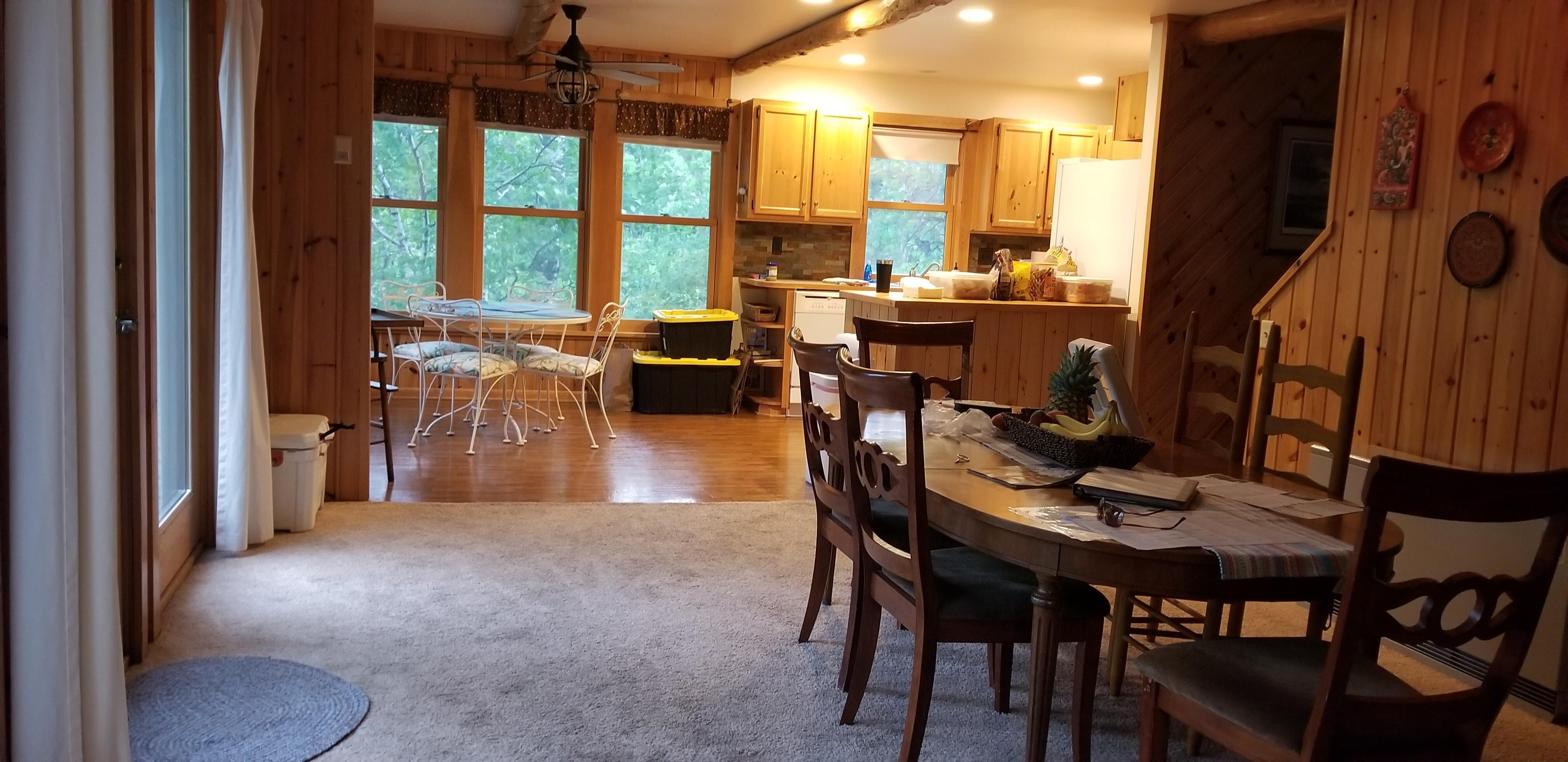 Many seating areas: kitchen, dining room, enclosed front porch, outdoor back porch, beachside gazebo, living room with fireplace and TV areas