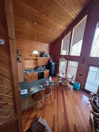 To the left of the walk way in (kitchen)