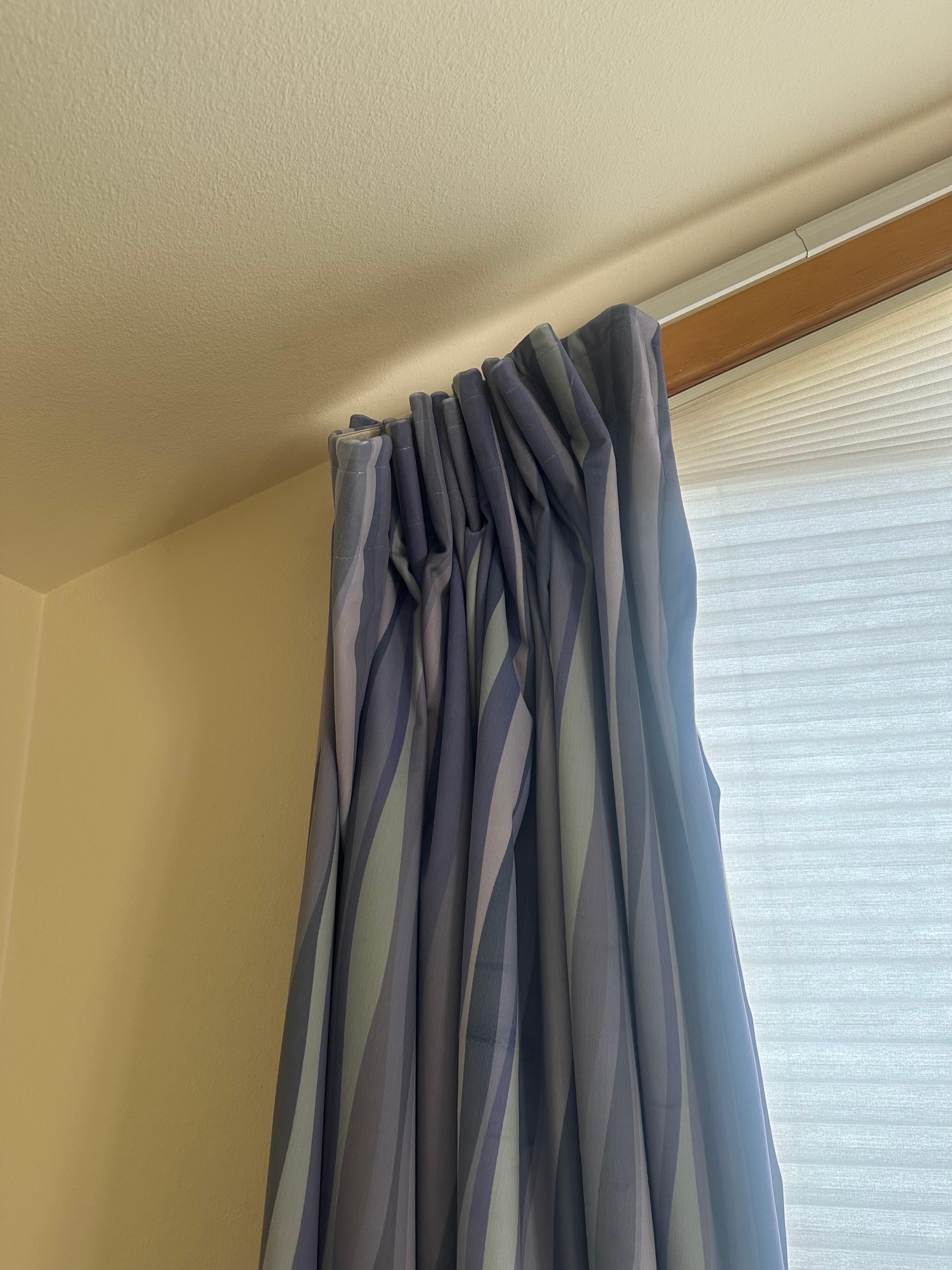 Curtains not all attached to the rod