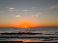 Sunset on the beach at the resort.