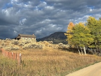 View of cabin from down the slope