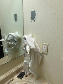 Mold and no towel hangers in the bathroom
